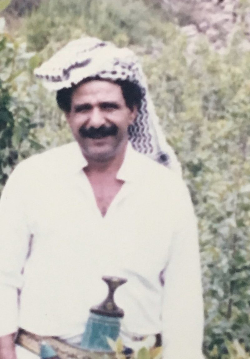 Joe outdoors in a traditional headwrap